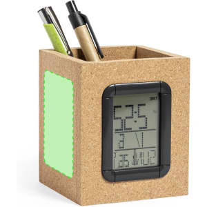 A cork pencil holder in light brown with a digital clock display, holding two pens in green and beige.