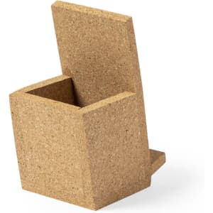 A square pencil holder made of natural cork, featuring a minimalist design and an angled back.