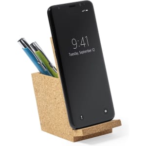 A cork pencil holder with multiple pens and a smartphone leaning against it, featuring a sleek black screen.