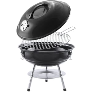 A barbecue grill with a glossy black finish and a shiny silver stand, featuring a removable lid and cooking grate.
