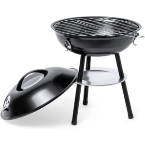 A black barbecue grill with a chrome cooking grate and a removable dome lid on a three-legged stand.