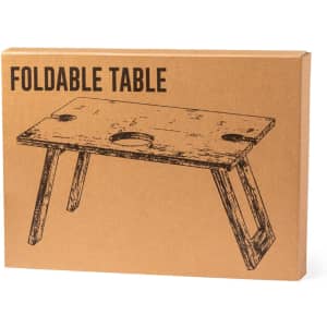 A foldable table packaged in a brown box, featuring a rustic wood design and a logo on the side.