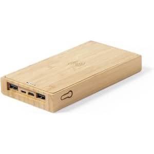 A bamboo power bank with multiple USB ports and a wireless charging feature. It has a simple, sleek design.