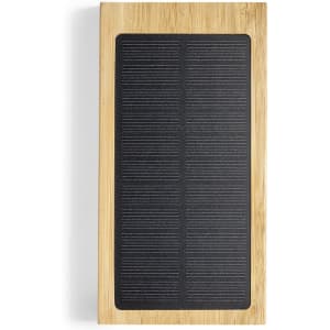 A rectangular power bank featuring a bamboo exterior and a black textured surface for charging devices.