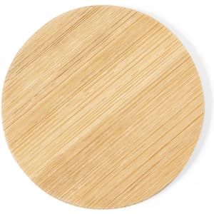 A round bamboo pocket mirror in a natural wood tone with a smooth, textured surface.