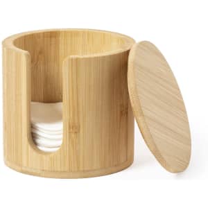 A bamboo cosmetic pad dispenser with a lid and a cut-out for easy access to cotton pads inside.