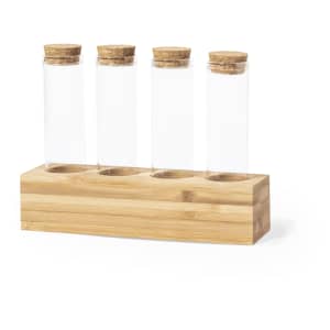 A wooden spice rack with four clear glass test tubes, each topped with a cork stopper.