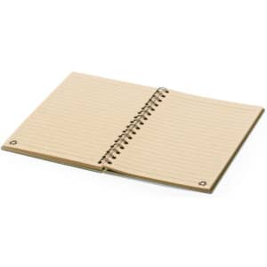 A spiral-bound notebook with lined pages and a light brown cover, featuring a subtle logo at the bottom corners.