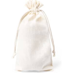 A drawstring bag in cream colour, made of fabric, featuring a gathered top for secure closure.