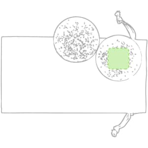 A set of two circular balls with a textured surface, placed on a flat surface. One ball is partially obscured.