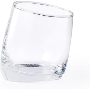 A glass tumbler in clear glass, featuring a tilted design. It has a simple, modern shape and a smooth surface.