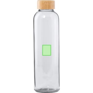 A drink bottle made of clear glass with a bamboo lid and a green square design on the front.