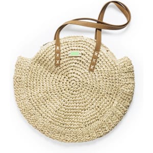 A round, woven straw tote bag with brown leather straps and a subtle logo.