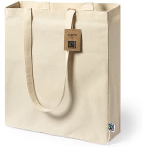 A beige tote bag with sturdy handles and a branding tag, made from fairtrade materials.