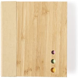 A notepad with a bamboo cover, featuring a plain design and three coloured dots on the front. It has a simple, natural appearance.