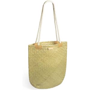 A woven tote bag in a natural straw colour with rope handles and leather accents.