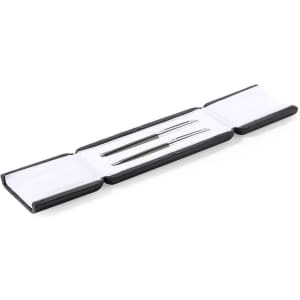 A set of two metal pens displayed in a black and white case, featuring a logo on the exterior.