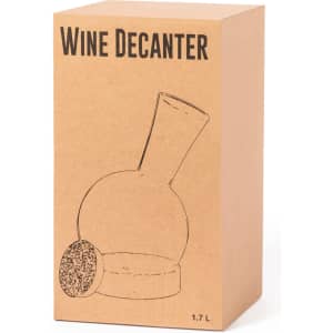 A wine decanter featuring a rounded body and a cork stopper, presented in a simple brown cardboard box.