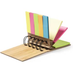 A sticky notepad holder featuring multiple coloured sticky notes on a wooden base with a metal spiral binding.