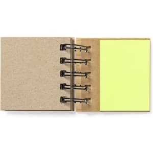 A sticky notepad with a kraft cover and yellow sticky notes, secured by metal rings.