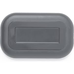 A wireless charger in a sleek grey design, featuring a minimalistic shape and a logo.