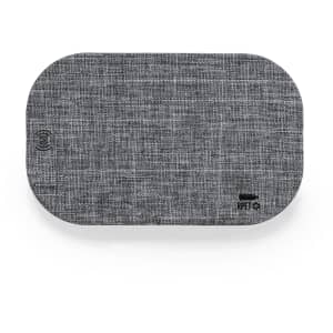 A wireless charger in a rectangular grey fabric design, featuring a logo on one corner.