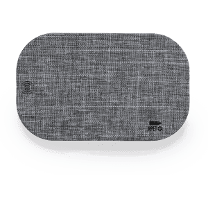 A grey wireless charger with a textured fabric surface and a logo on one side.