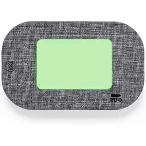 A wireless charger with a grey fabric exterior and a light green charging surface. It features a logo.