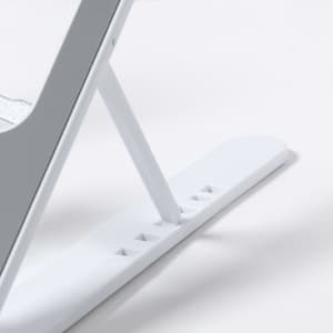A white phone holder with a sleek design, featuring adjustable positioning and a minimalist aesthetic.