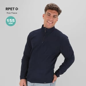 A navy polar fleece jacket with a half-zip design and a logo on the front. The model is smiling.