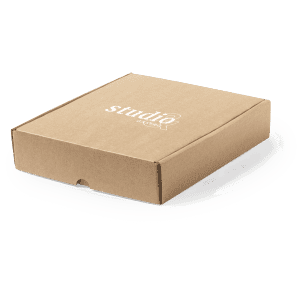 A brown cardboard gift box with a logo on the top surface, featuring a flap closure.