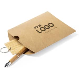 A kraft paper gift box containing a pen and a wooden keyring, featuring a logo on the front.
