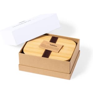 A bamboo lunch box with a strap, presented in a tan and white box. The product has a branded label.