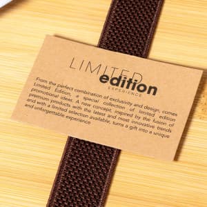 A brown textured strap with a tag that has the words "Limited Edition" printed on a light brown background.