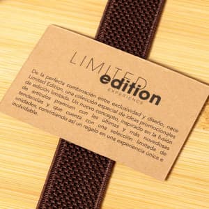 A brown tag with the words "Limited Edition" and a textured strap in a rich, deep brown colour.