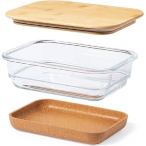 A glass lunch box set featuring a clear glass container, a cork base, and a bamboo lid.