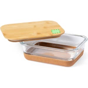 A glass lunch box with a bamboo lid and a cork base, featuring a sleek, modern design.
