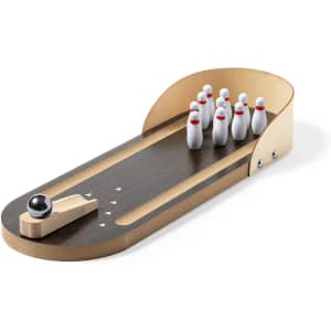 A wooden bowling minigame set featuring a lane, seven white pins with red stripes, and a black bowling ball.