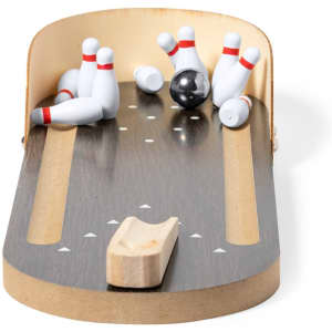 A wooden minigame bowling setup features a lane, a black bowling ball, and scattered white pins with red stripes.