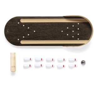 A mini bowling game set with a wooden track, ten white pins, a ball, and a wooden ramp.