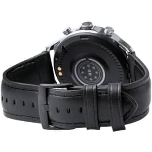 A smart watch with a black leather strap, featuring a round dial and a logo on the back.