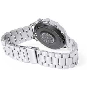 A silver smart watch with a metallic band, featuring a round back and multiple buttons. It has a logo on the back.