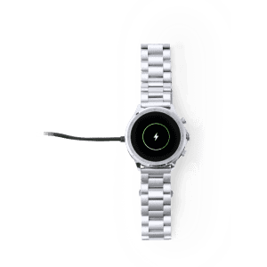 A silver smart watch with a round face and a charging cable attached. The watch features a sleek stainless steel band.