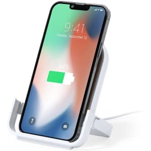 A wireless charger in white, designed to hold a smartphone while it charges, featuring a sleek stand.