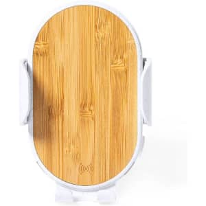 A wireless charger holder with a wooden texture surface and a white base. It features a logo on the front.