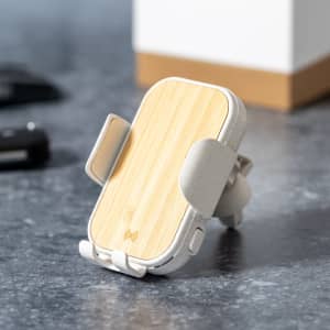 A wireless charger holder in a grey and bamboo finish, featuring a logo and a sleek, modern design.