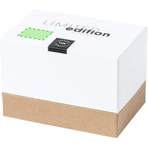 A white and brown box with a removable lid, marked as a limited edition product. It features a logo and a green sticker.