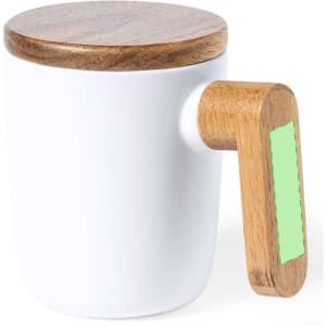 A white coffee mug with a wooden lid and a wooden handle featuring a green accent.