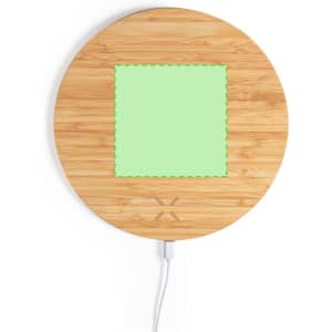 A round wooden mousepad with a green charging area in the centre, featuring a connected cable.