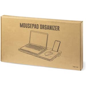 A cardboard box containing a mousepad organizer with space for a laptop, mouse, and phone. The design is simple and functional.